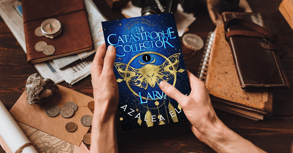 Person holding a Paperback of Larva